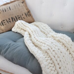 Chunky knit lap throw on settee
