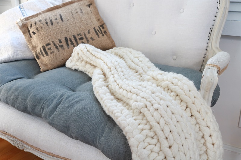 Chunky knit lap throw on settee