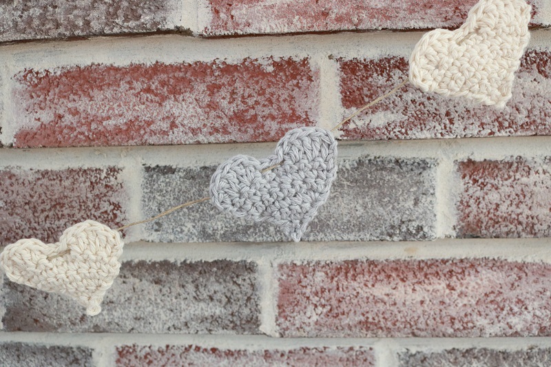 Crochet Heart pattern as garland on mantel