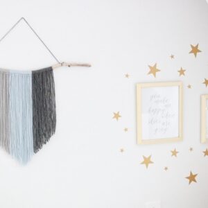 DIY Yarn Fringe Wall Hanging - finished hanging in room
