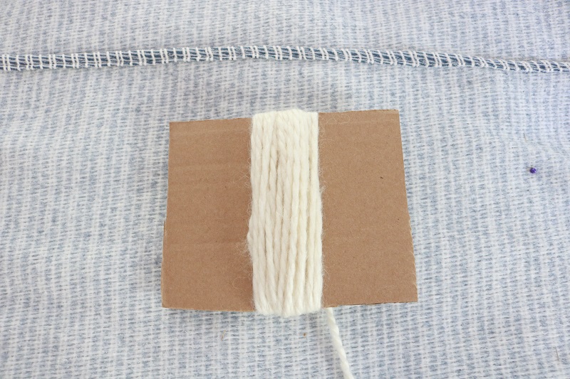 Farmhouse Tassel Pillows - fringe yarn around cardboard