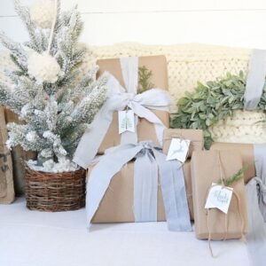 Make your own muslin ribbons by dyeing strips of muslin fabric. Dye the ribbons any color you'd like using Rit fabric dye. They're perfect for a rustic farmhouse style! #christmasribbon #weddingribbon #handdyeribbon