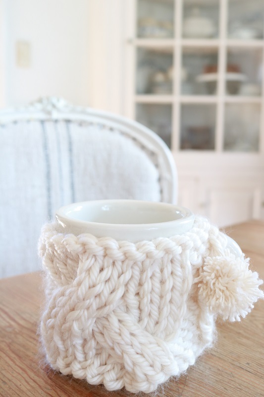 cable knit mug cozy on table