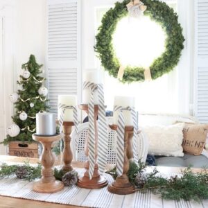 Deck the halls for a farmhouse Christmas with ticking stripe fabric. This year I decorated our dining room with a farmhouse style theme and ticking stripes fabric. Blue and white galore! #farmhousechristmas #tickingstripes #christmasdiningroom