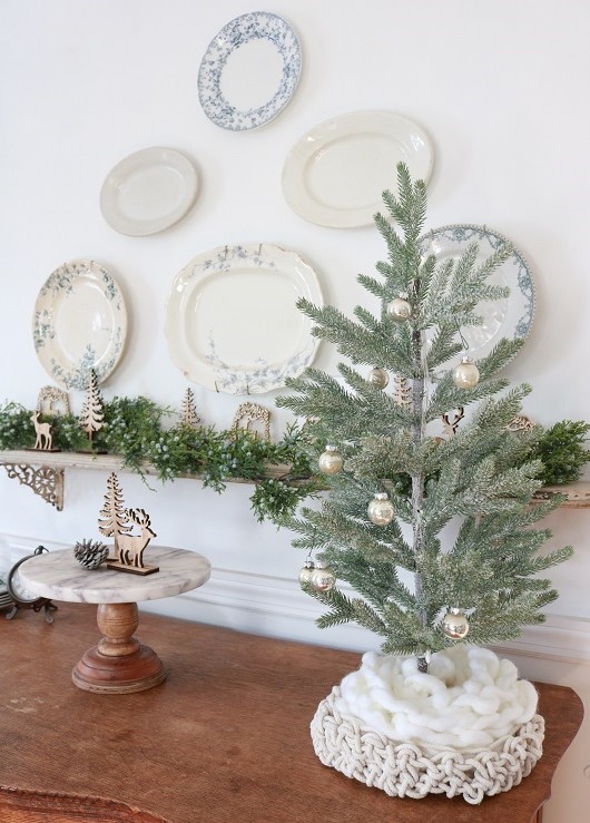 Deck the halls for a farmhouse Christmas with ticking stripe fabric. This year I decorated our dining room with a farmhouse style theme and ticking stripes fabric. Blue and white galore! #farmhousechristmas #tickingstripes #christmasdiningroom