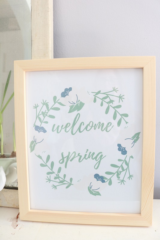Welcome Spring Printable - on bookshelf, closeup