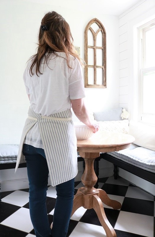 Farmhouse Style Pocket Apron - wearing in kitchen, at table, back of apron