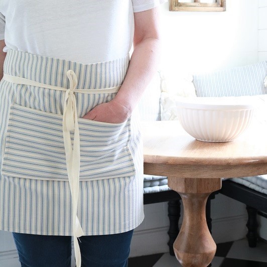Farmhouse Style Pocket Apron - wearing in kitchen, feature