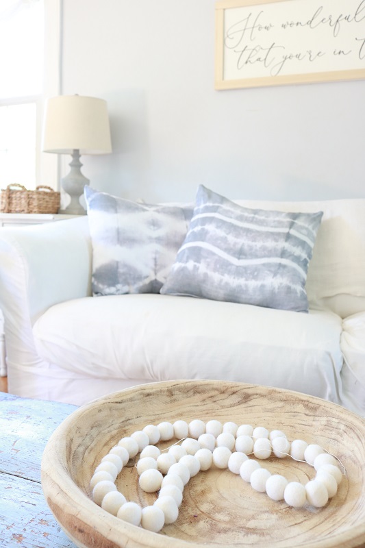 Shibori Tie Dye Pillows - pillows on couch with wood bowl