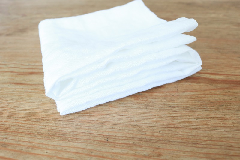 Shibori Tie Dye Pillows - white linen square folded accordion style other direction