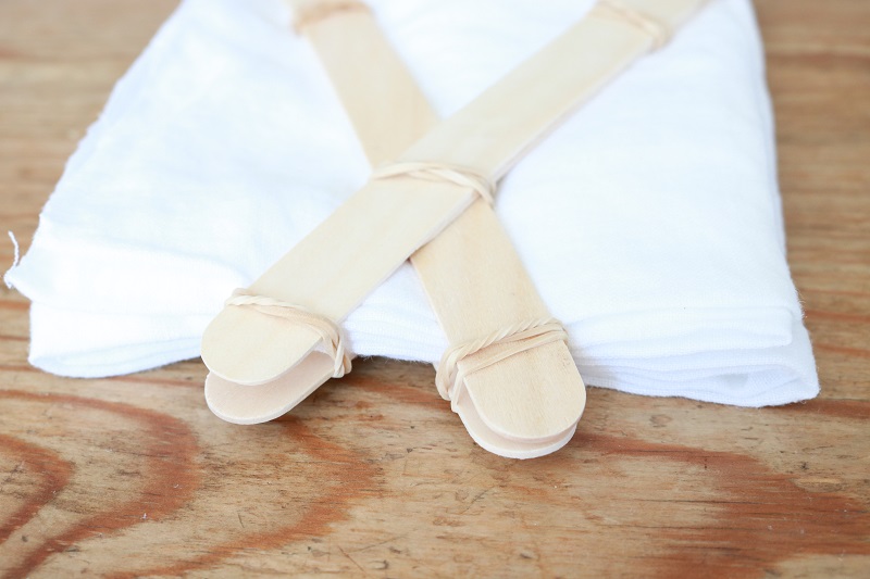 Shibori Tie Dye Pillows - white linen square prepared for V pattern, closeup