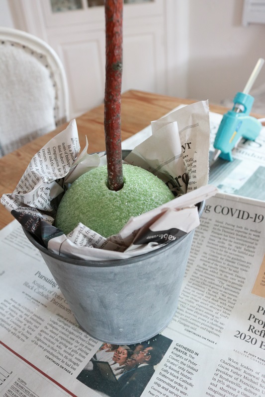 DIY Faux Olive Topiary - place ball in pot with newspaper