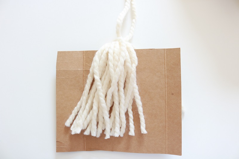 DIY Blanket Tassel - cut yarn from cardboard