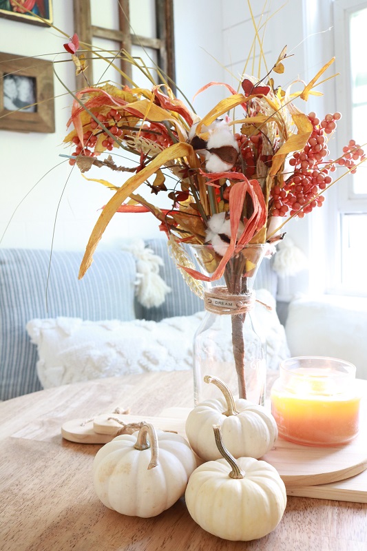 Faux Fall Leaf Garland - fall stems on kitchen table, closeup