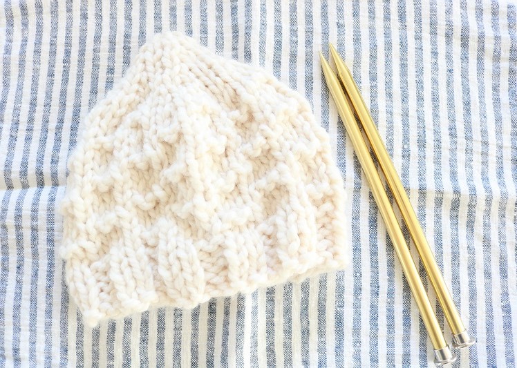 Chunky Knit Beanie Hat - finished hat, on towel with needles