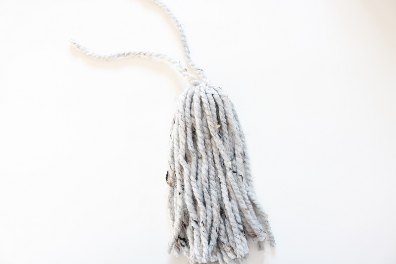 Knit Chunky Cable Scarf - tassel, cut tassel from cardboard