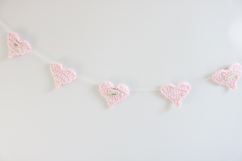 Crochet Heart Garland - entire garland on wall