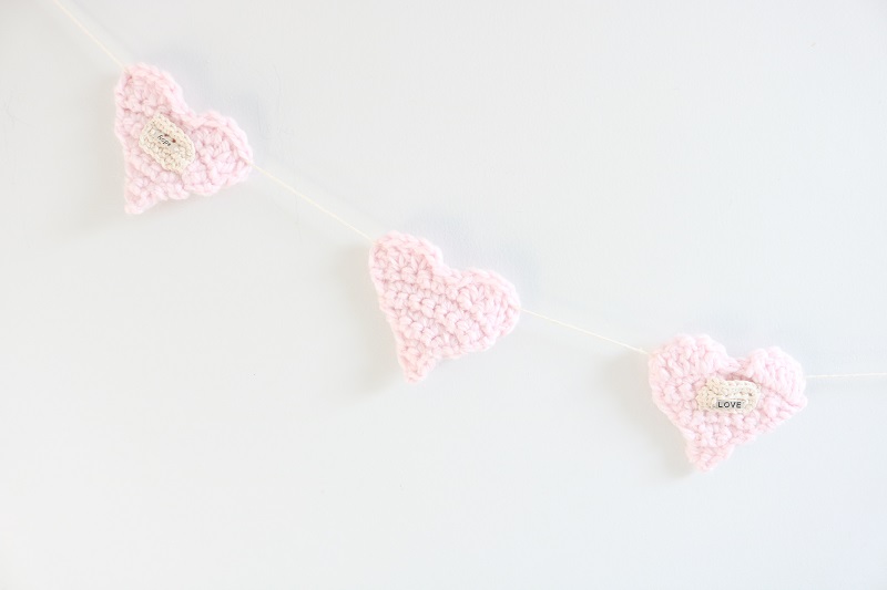 Crochet Heart Garland - part of garland on wall