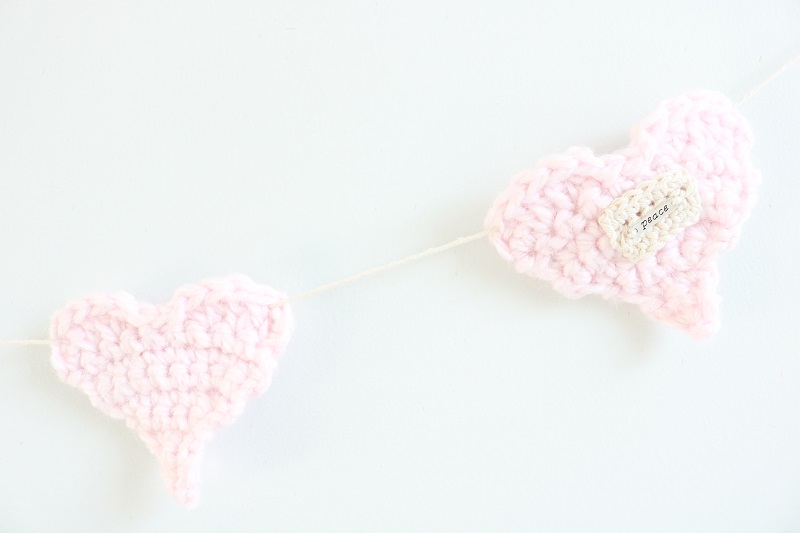 Crochet Heart Garland - two hearts on wall