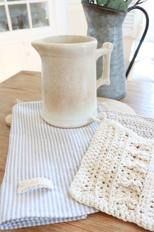 Ticking Stripe Tea Towel - finished towel with wash cloths on table, closeup