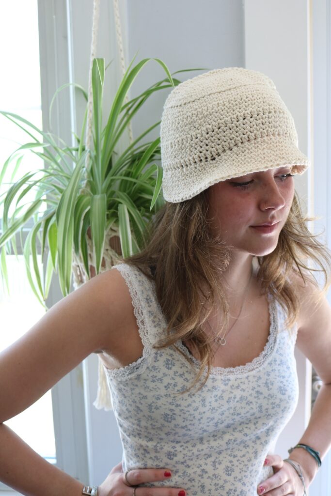 woman wearing cotton crochet bucket hat