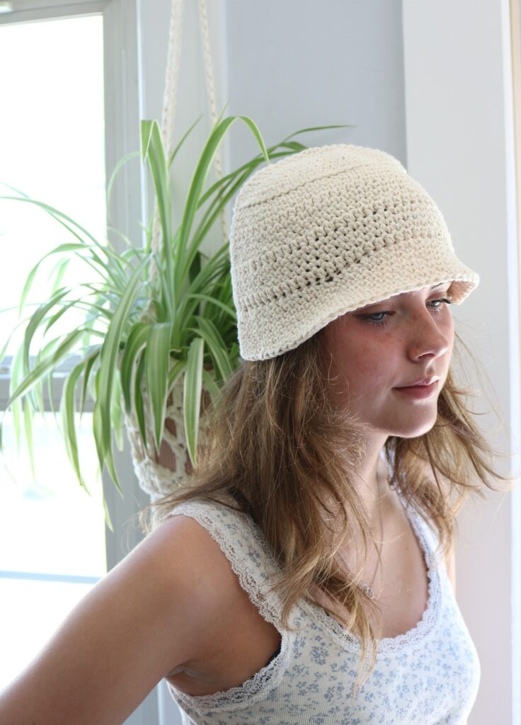 woman wearing cotton crochet bucket hat