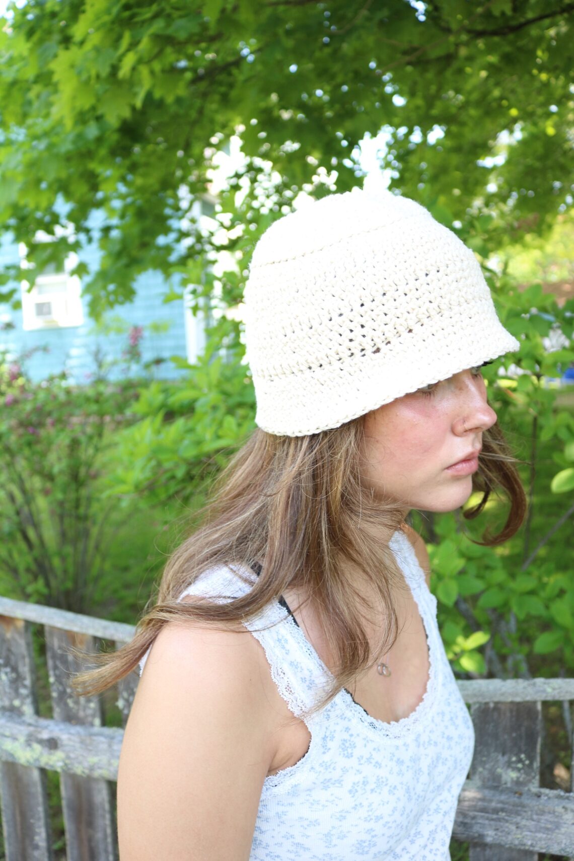 woman wearing cotton crochet bucket hat