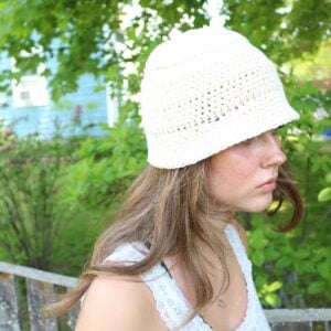 woman wearing cotton crochet bucket hat