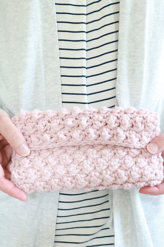 Crochet Clutch Bag - holding finished crochet bag, closeup