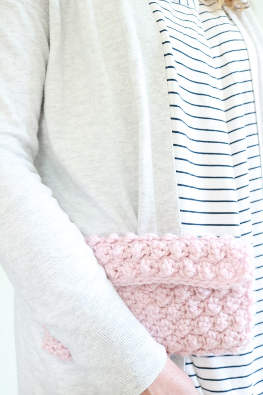 Crochet Clutch Bag - holding finished crochet bag under arm