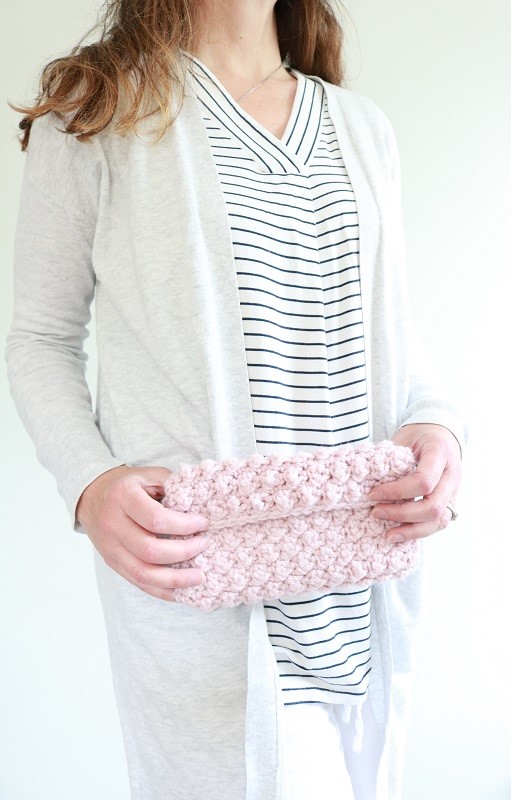 Crochet Clutch Bag - holding finished crochet bag