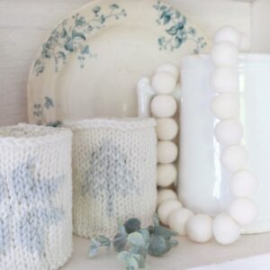 Knit Candle Cozies - finished cozies on shelf