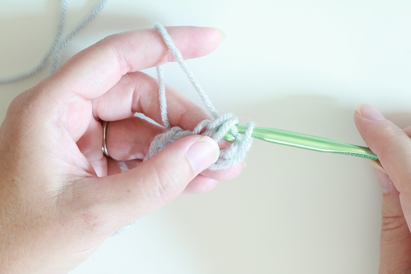 Basic Crochet Stitches - dc st - pull yarn through first 2 loops