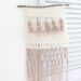 Autumn Exclusive - Fringe Crochet Wall Hanging - finished wall hanging on shutter