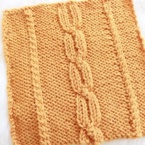 Fall Cable 8 inch Square Knit Pattern - finished square on fur