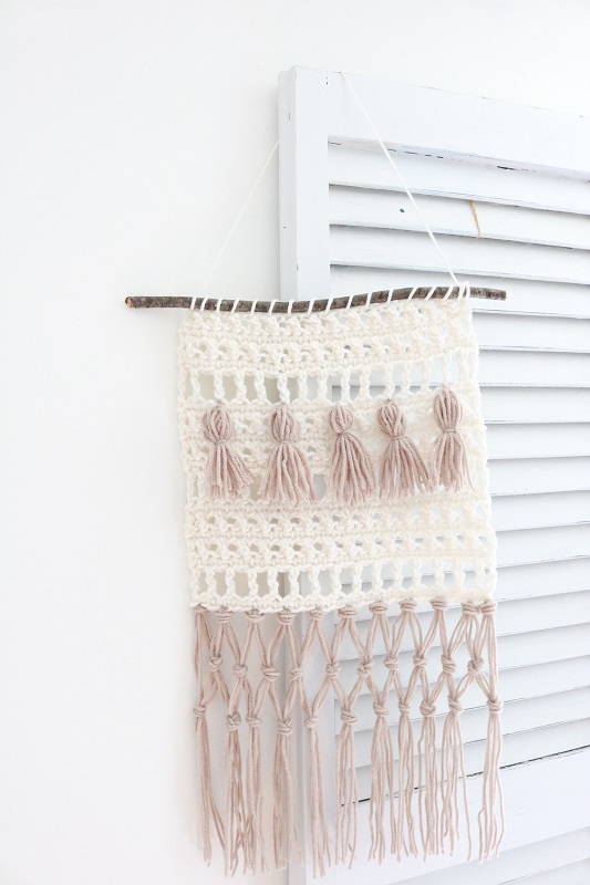 Fringe Crochet Wall Hanging - finished wall hanging on shutter