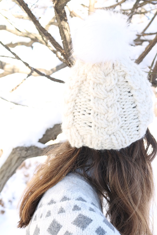 Cream Cable Hat - wearing outside, back view