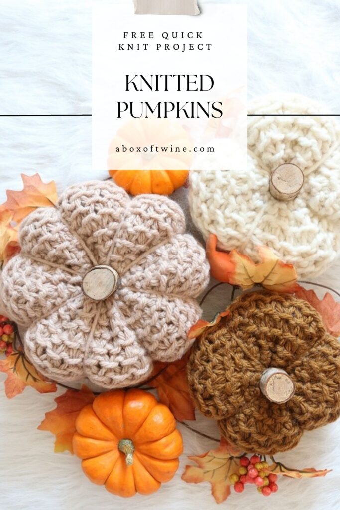 knit pumpkins displayed on table
