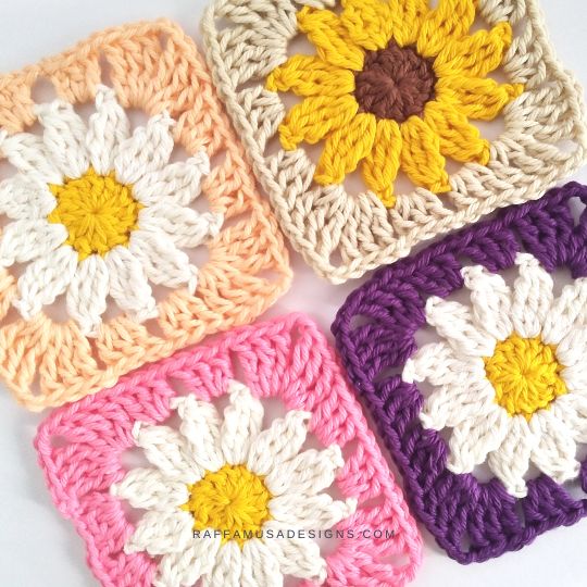 4 crochet daisy squares on table