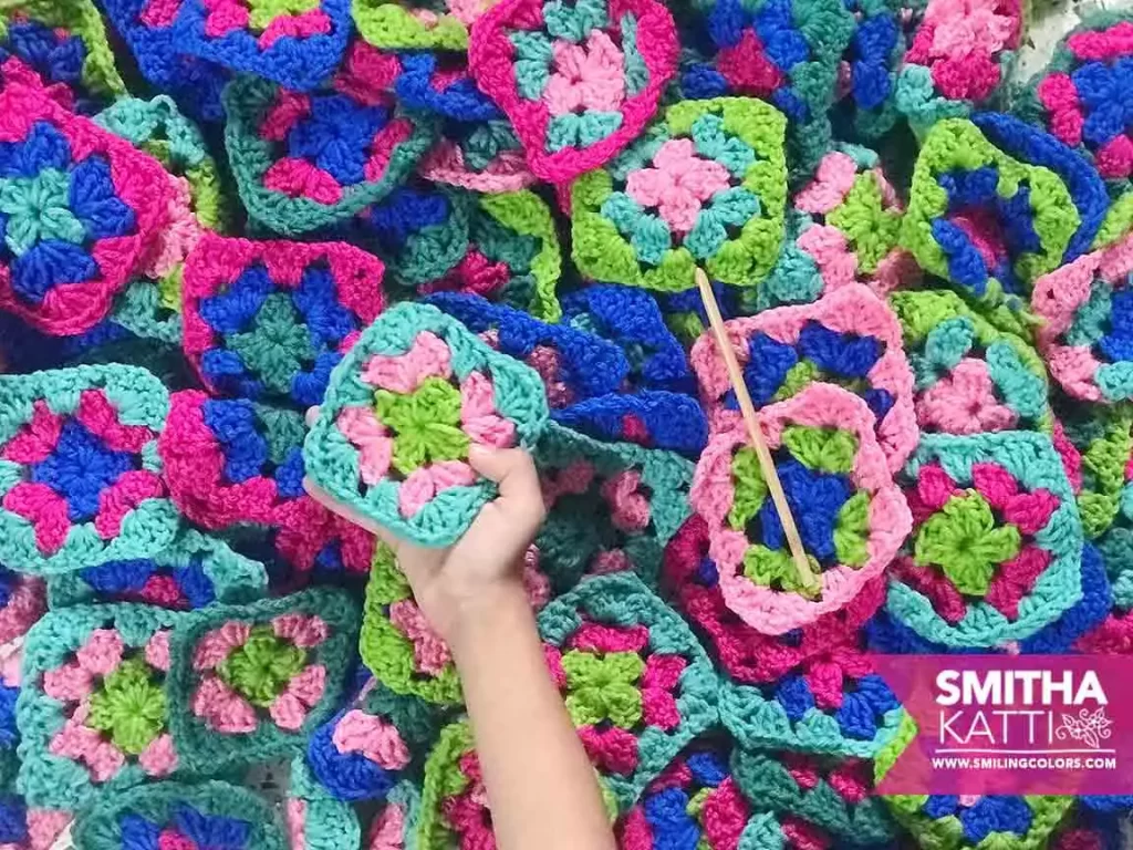 pile of colorful crochet granny squares