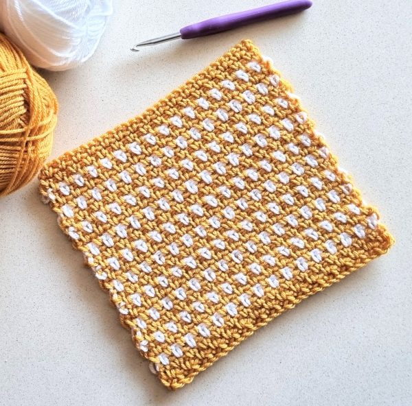 moss stitch crochet square on table