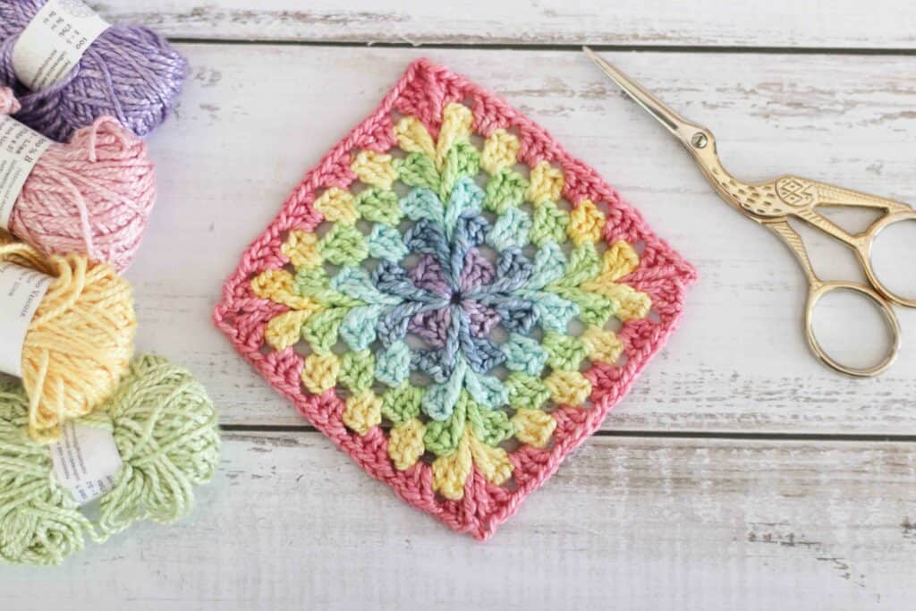 starburst crochet granny square on table