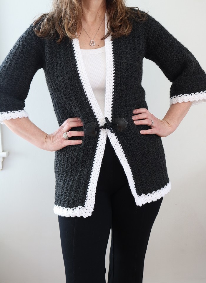 woman wearing crochet cardigan