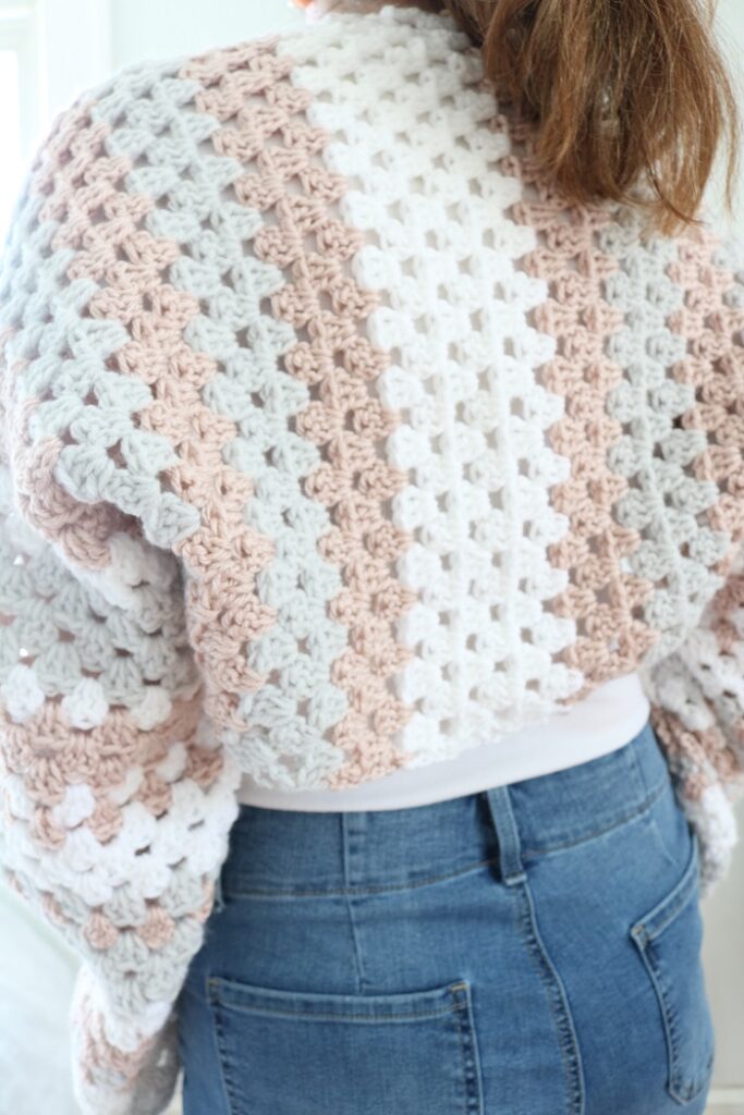 back view of woman wearing crochet shrug