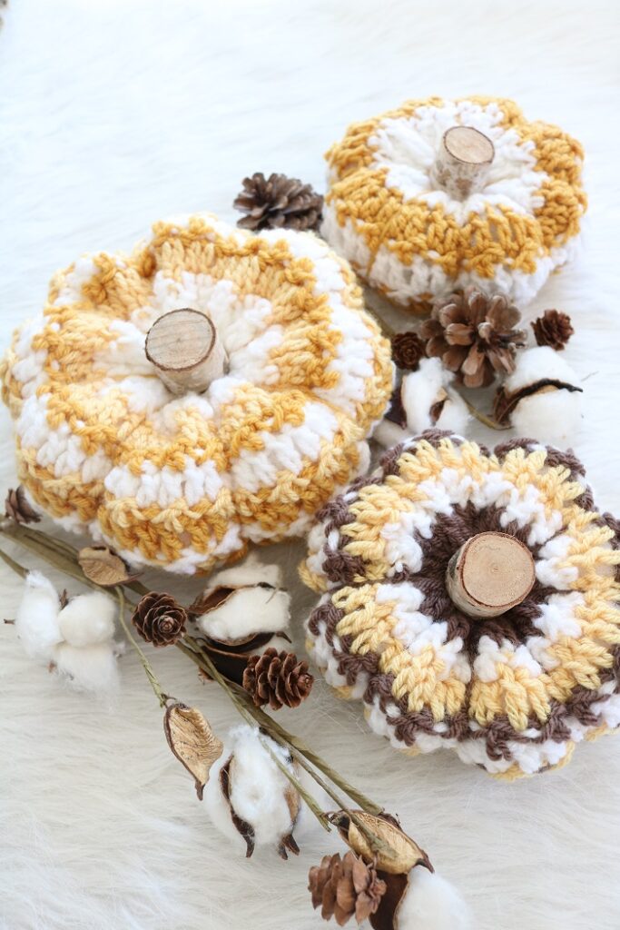 crochet pumpkins on table