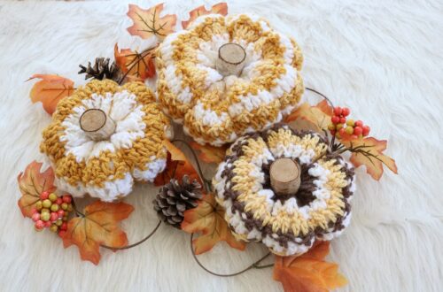 crochet pumpkins on table