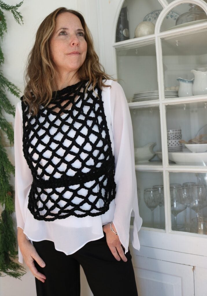 Crochet pattern chenille vest in black - wearing afar 2