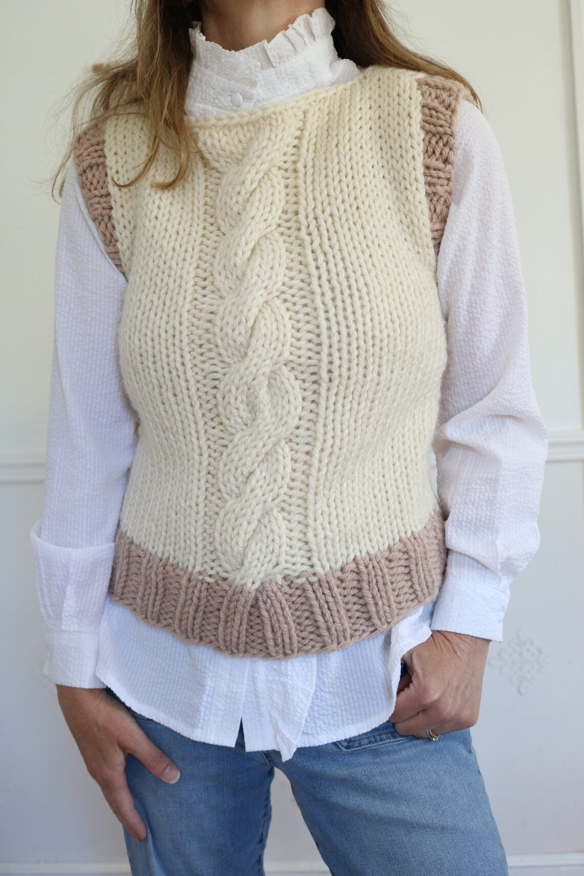 woman wearing cable knit vest
