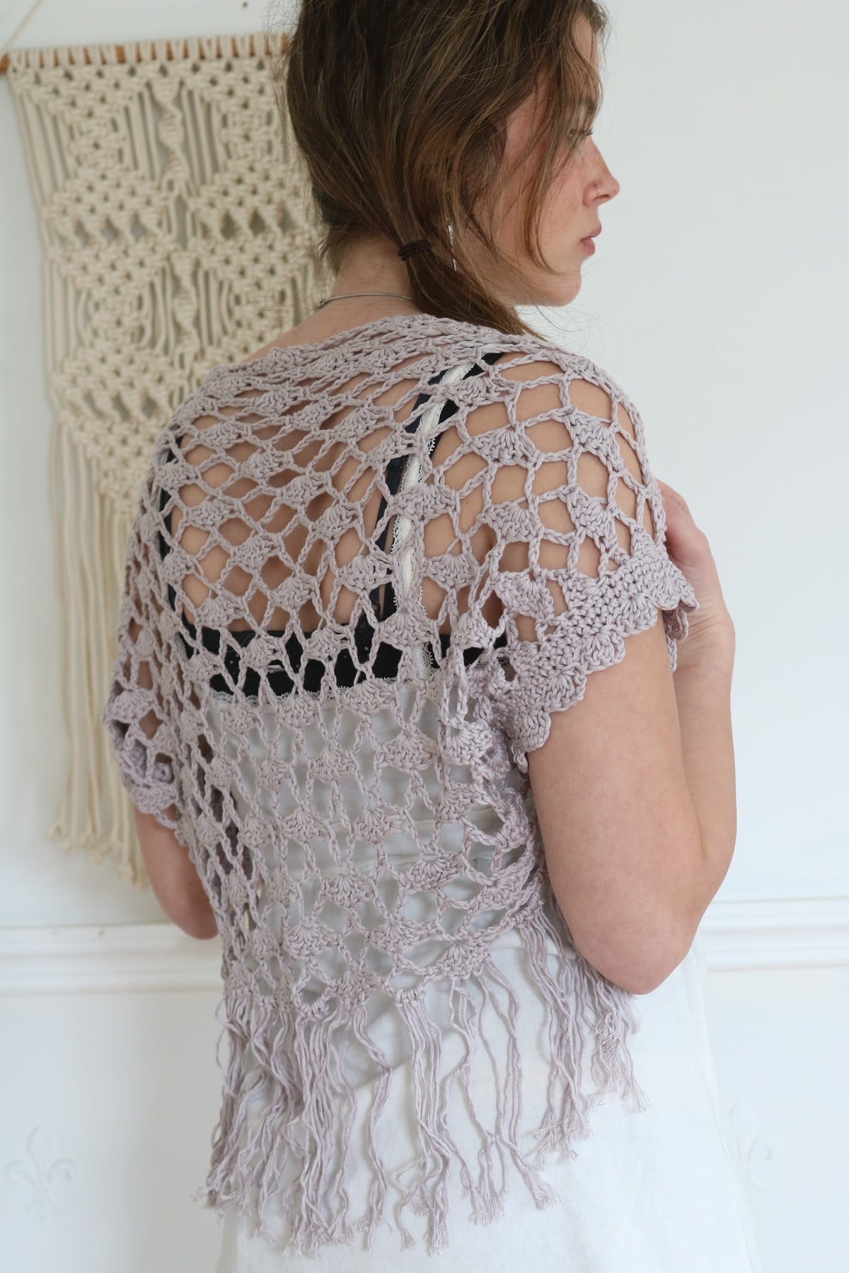 back view of woman wearing summer crochet shrug