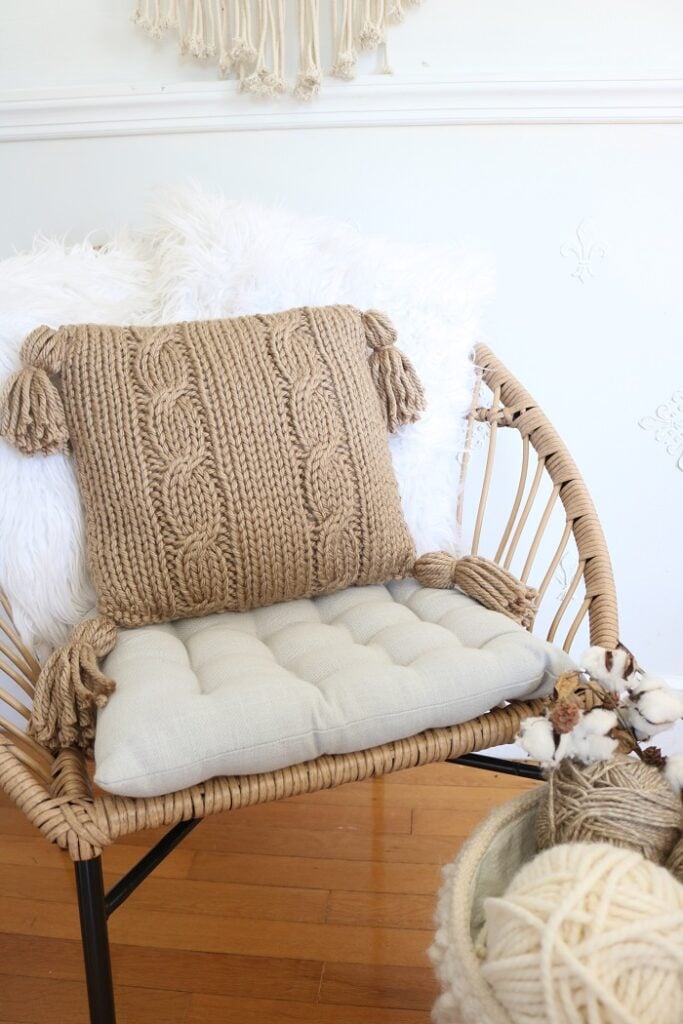 Cable Pillow Cover Knit Pattern - on chair with tufted pillow, 2 faux fur pillow, closer